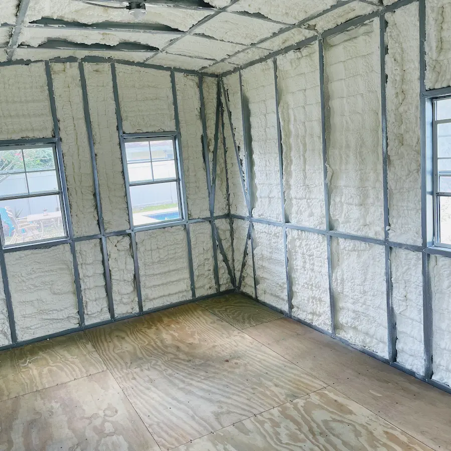 Closed-cell spray foam insulation applied to wall cavities in a residential project in Concord